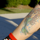 A mermaid tattoo belonging to Susie Pennoyer, a Legendary Siren. Photo: Raul Marrero/Gizmodo Media Group